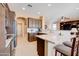 Kitchen features granite countertops and dark wood cabinetry at 29711 N Yellow Bee Dr, San Tan Valley, AZ 85143