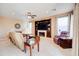 Living room with a cozy fireplace and large windows at 29711 N Yellow Bee Dr, San Tan Valley, AZ 85143