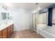 Elegant bathroom with double vanity, soaking tub and shower at 29808 N Yellow Bee Dr, San Tan Valley, AZ 85143