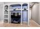 Built-in entertainment center with shelving at 29808 N Yellow Bee Dr, San Tan Valley, AZ 85143