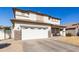 Two-story house with a white garage door and brown roof at 29808 N Yellow Bee Dr, San Tan Valley, AZ 85143