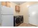 Laundry room with washer, dryer and additional storage at 29808 N Yellow Bee Dr, San Tan Valley, AZ 85143