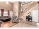 Living room with hardwood floors and a staircase at 29808 N Yellow Bee Dr, San Tan Valley, AZ 85143