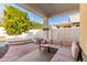 Relaxing covered patio with seating area and access to the backyard at 29808 N Yellow Bee Dr, San Tan Valley, AZ 85143