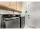 Laundry room with modern washer and dryer, cabinets at 30061 N 70Th Dr, Peoria, AZ 85383