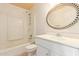 Bathroom with white vanity, a large mirror, and a shower/tub combo at 3009 W Potter Dr, Phoenix, AZ 85027