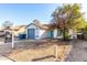 Ranch style home with a gray garage door and turquoise front door at 3009 W Potter Dr, Phoenix, AZ 85027