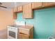 View of kitchen's wood cabinets and electric stove top at 3009 W Potter Dr, Phoenix, AZ 85027