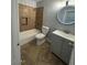 Renovated bathroom with vanity, toilet and bathtub at 3028 W Bloomfield Rd, Phoenix, AZ 85029