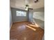 Well-lit bedroom with hardwood flooring and ceiling fan at 3028 W Bloomfield Rd, Phoenix, AZ 85029