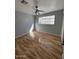 Spacious bedroom featuring wood floors and a ceiling fan at 3028 W Bloomfield Rd, Phoenix, AZ 85029