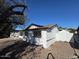 Side view of the house showcasing its white exterior at 3028 W Bloomfield Rd, Phoenix, AZ 85029