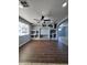 Bright living room featuring built-in shelving and tile flooring at 3028 W Bloomfield Rd, Phoenix, AZ 85029