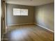 Spacious bedroom with neutral walls and wood-look floors at 3031 N Civic Center Plz # 130, Scottsdale, AZ 85251