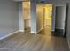 Bright bedroom with wood-look floors and spacious closet at 3031 N Civic Center Plz # 130, Scottsdale, AZ 85251