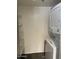 Stackable washer and dryer with additional shelving at 3031 N Civic Center Plz # 130, Scottsdale, AZ 85251