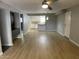 Open living room with wood-look floors and kitchen views at 3031 N Civic Center Plz # 130, Scottsdale, AZ 85251