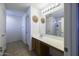 Bathroom with a double vanity and a large mirror at 40112 W Catherine Dr, Maricopa, AZ 85138