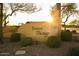 Desert Passage community entrance sign with landscaping at sunset at 40112 W Catherine Dr, Maricopa, AZ 85138