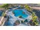 Aerial view of a refreshing community pool with palm trees at 40112 W Catherine Dr, Maricopa, AZ 85138