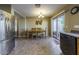 Kitchen dining area with table and stainless steel appliances at 40112 W Catherine Dr, Maricopa, AZ 85138