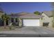 One-story house with a white garage door and landscaped yard at 40112 W Catherine Dr, Maricopa, AZ 85138