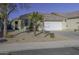 Single-story house with a white garage door and a palm tree in front at 40112 W Catherine Dr, Maricopa, AZ 85138