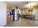 Kitchen with stainless steel refrigerator and wood cabinets at 40112 W Catherine Dr, Maricopa, AZ 85138