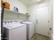 Laundry room with washer, dryer, and shelving at 40112 W Catherine Dr, Maricopa, AZ 85138