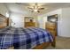 Main bedroom with a large bed and dresser at 40112 W Catherine Dr, Maricopa, AZ 85138