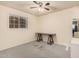 Bedroom with a wooden desk and ceiling fan at 4321 W Greenway Rd, Glendale, AZ 85306