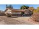 House exterior with stone accents and a large driveway at 4321 W Greenway Rd, Glendale, AZ 85306