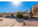 Exterior of house with landscaping and a curved driveway at 4321 W Greenway Rd, Glendale, AZ 85306