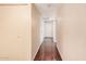 Long hallway with light walls and wood flooring at 4321 W Greenway Rd, Glendale, AZ 85306