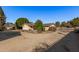 View of home's side, showing patio and gate at 4321 W Greenway Rd, Glendale, AZ 85306