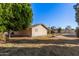 Home's side view, showing backyard and landscaping at 4321 W Greenway Rd, Glendale, AZ 85306