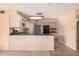 Kitchen with black appliances and wood cabinetry at 4321 W Greenway Rd, Glendale, AZ 85306