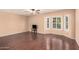 Spacious living area with hardwood floors and bay window at 4321 W Greenway Rd, Glendale, AZ 85306