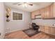 Home office with built-in desk and ceiling fan at 4321 W Greenway Rd, Glendale, AZ 85306