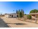 Detached workshop, side view, mature trees at 4321 W Greenway Rd, Glendale, AZ 85306