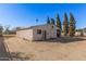 Detached workshop with large roll-up door at 4321 W Greenway Rd, Glendale, AZ 85306