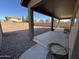 Backyard patio with gravel and a covered porch at 44152 W Pioneer Rd, Maricopa, AZ 85139