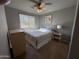 Spacious bedroom with a queen-size bed and ample natural light at 44152 W Pioneer Rd, Maricopa, AZ 85139