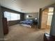 Spacious bedroom with a large bed and ensuite bathroom at 44152 W Pioneer Rd, Maricopa, AZ 85139