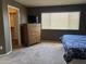 Bedroom with double bed, dresser, and large window at 44152 W Pioneer Rd, Maricopa, AZ 85139