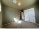 Well-lit bedroom with double doors and neutral walls at 44152 W Pioneer Rd, Maricopa, AZ 85139