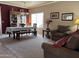 Bright dining room featuring a table and chairs, situated near the living room at 44152 W Pioneer Rd, Maricopa, AZ 85139