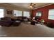 Living room with a cozy seating arrangement and a view of the kitchen at 44152 W Pioneer Rd, Maricopa, AZ 85139