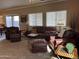 Living area with leather sofas and chairs, offering an open floor plan at 44152 W Pioneer Rd, Maricopa, AZ 85139