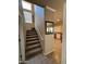 Indoor staircase with carpet and tile flooring at 44152 W Pioneer Rd, Maricopa, AZ 85139